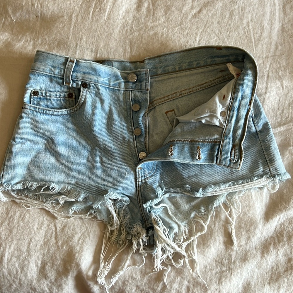 Vintage distressed Levi cut off short shorts with button fly